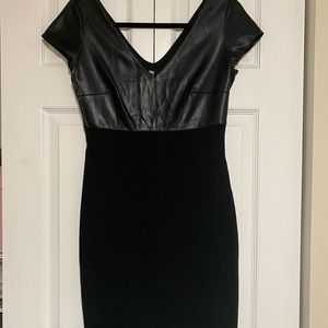 Black body con dress with leather top half.